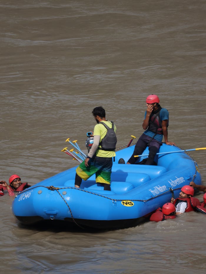 Experience thrilling white-water rafting on the Ganges at Rishikesh, with a team in action.
